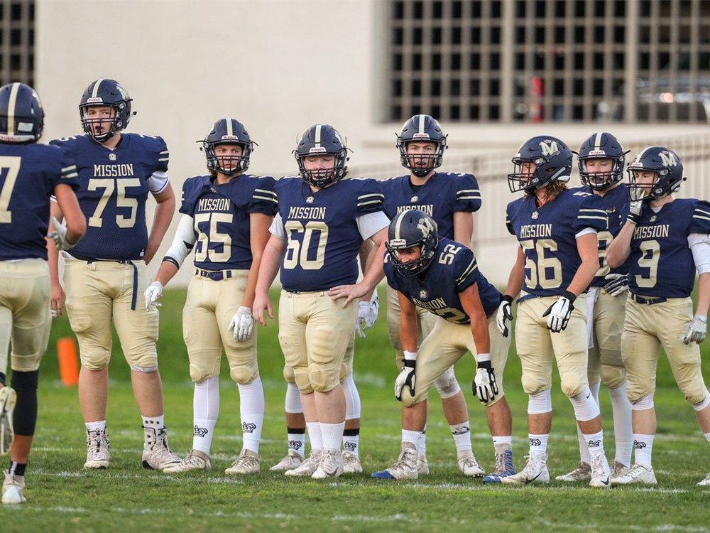 High school football uniform manufacturer producing custom football jerseys and pants for school teams